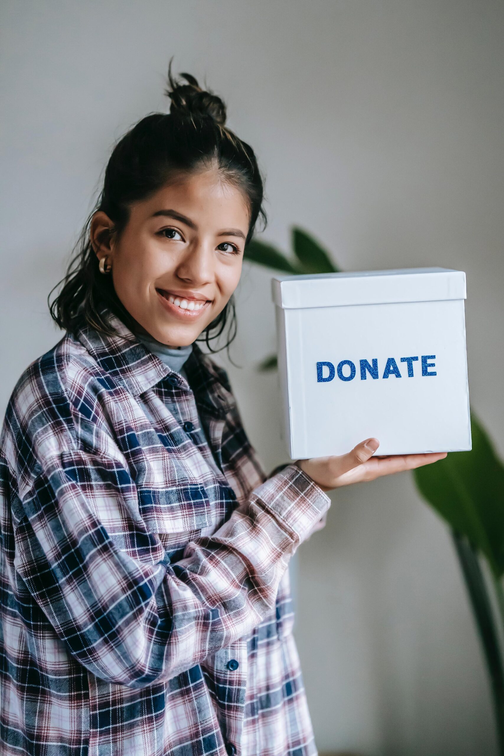 Girl showing donate box