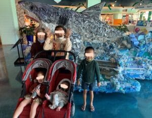 This is a picture of a family including foster children during a visit to The Florida Aquarium in Tampa